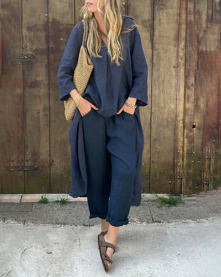 Woman wearing a coordinated two-piece set in navy blue with a relaxed, flattering fit