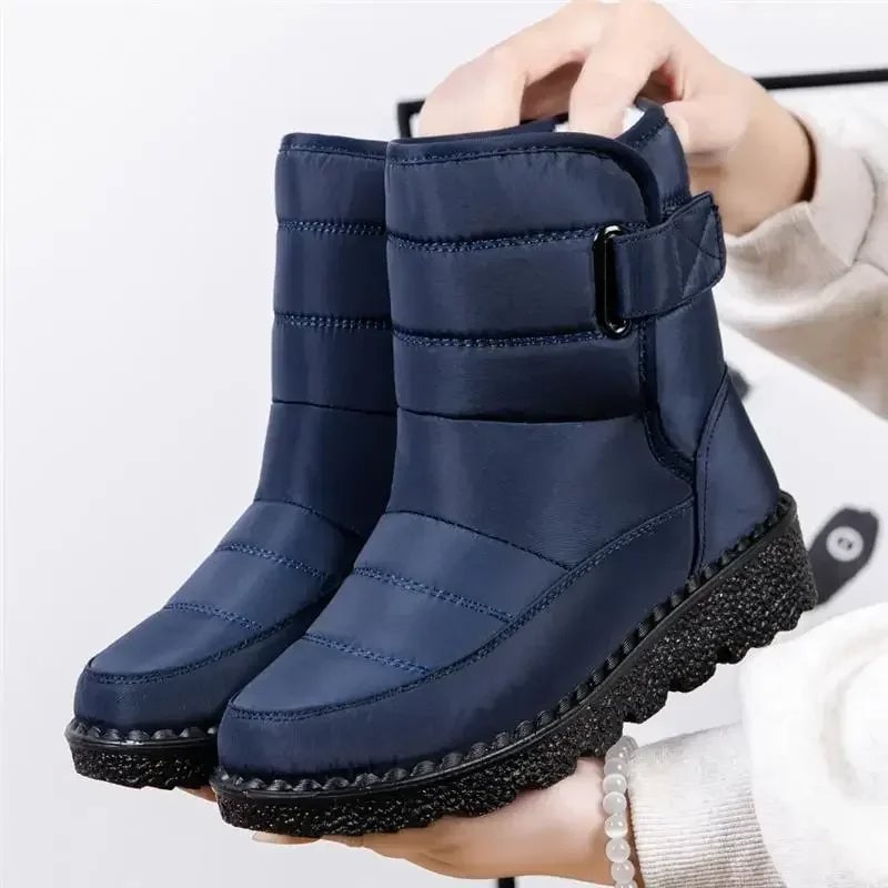 Women's waterproof boots styled with jeans showing leg-lengthening profile