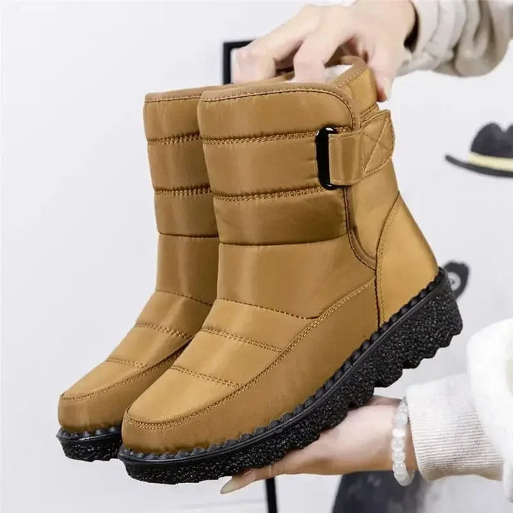 Women's waterproof boots in gray shown from a side angle