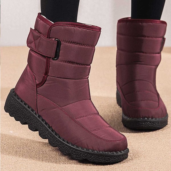Women's waterproof boots in blue highlighting streamlined boot profile