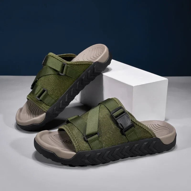Joy women's slip-on slippers in khaki shown from a front three-quarter angle on a clean background
