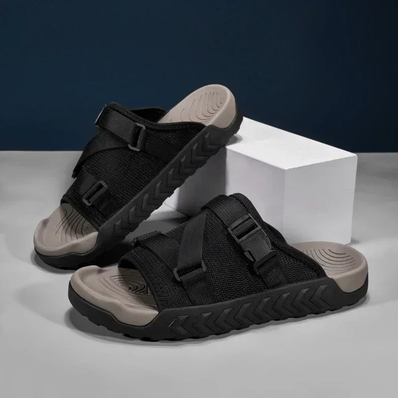 Joy slip-on slippers in green displayed from the side to show the sleek minimalist profile