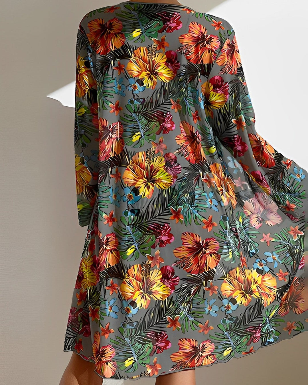Front view of tropical print bikini set showing adjustable top and high-waisted bottoms with coordinating lightweight cover-up