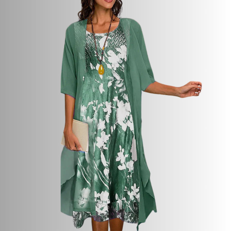 Model wearing a floral green 2-piece short-sleeve blouse and flowy dress set from Florimay