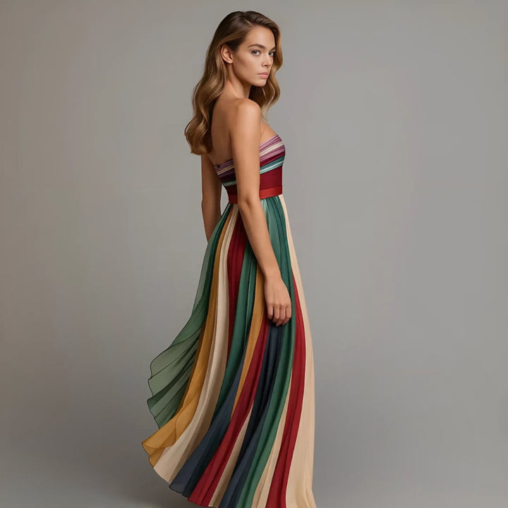 Back view of the strapless holiday glam maxi dress highlighting the fitted bodice and sweeping pleated skirt