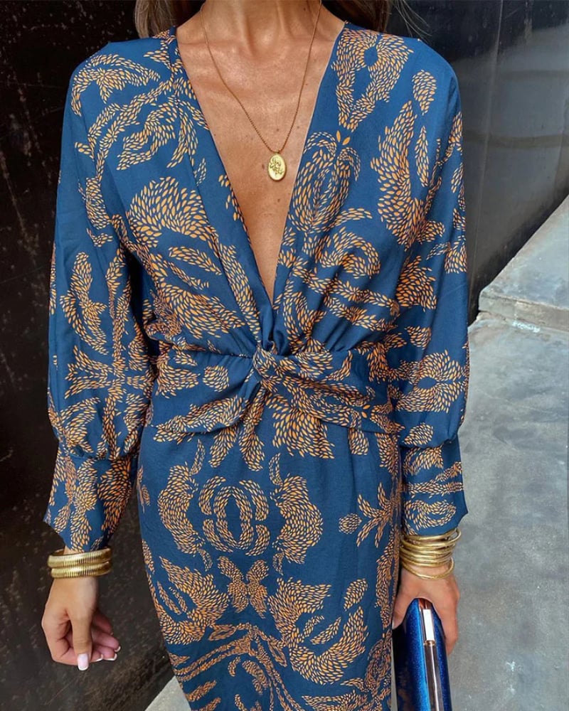 Side profile of a blue long sleeve maxi dress highlighting the flowing silhouette
