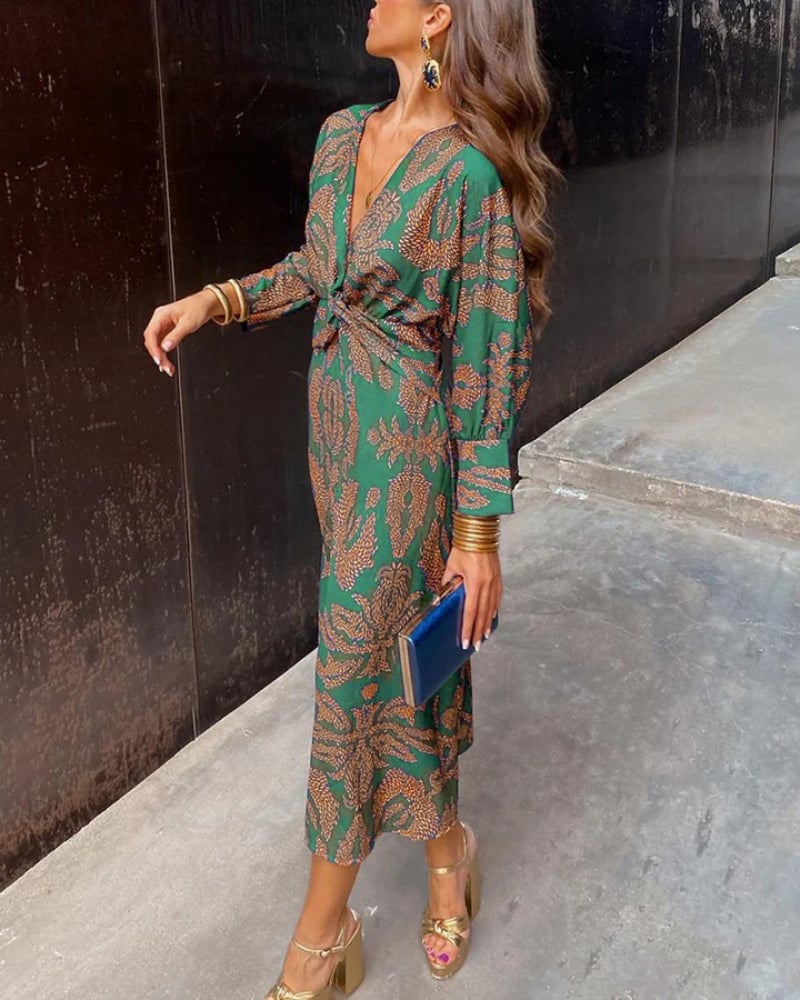 Full-length back view of a green long sleeve maxi dress with graceful drape detail