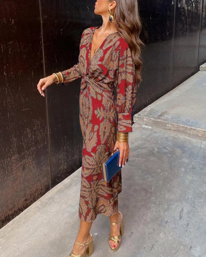 Detail shot of the sleeve and bodice draping on a pink long sleeve maxi dress