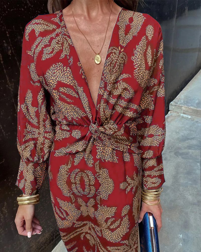 Green long sleeve maxi dress laid flat showing the full length and fabric texture