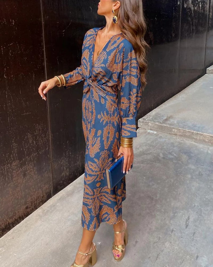 Pink long sleeve maxi dress on a model highlighting the curve-flattering fit