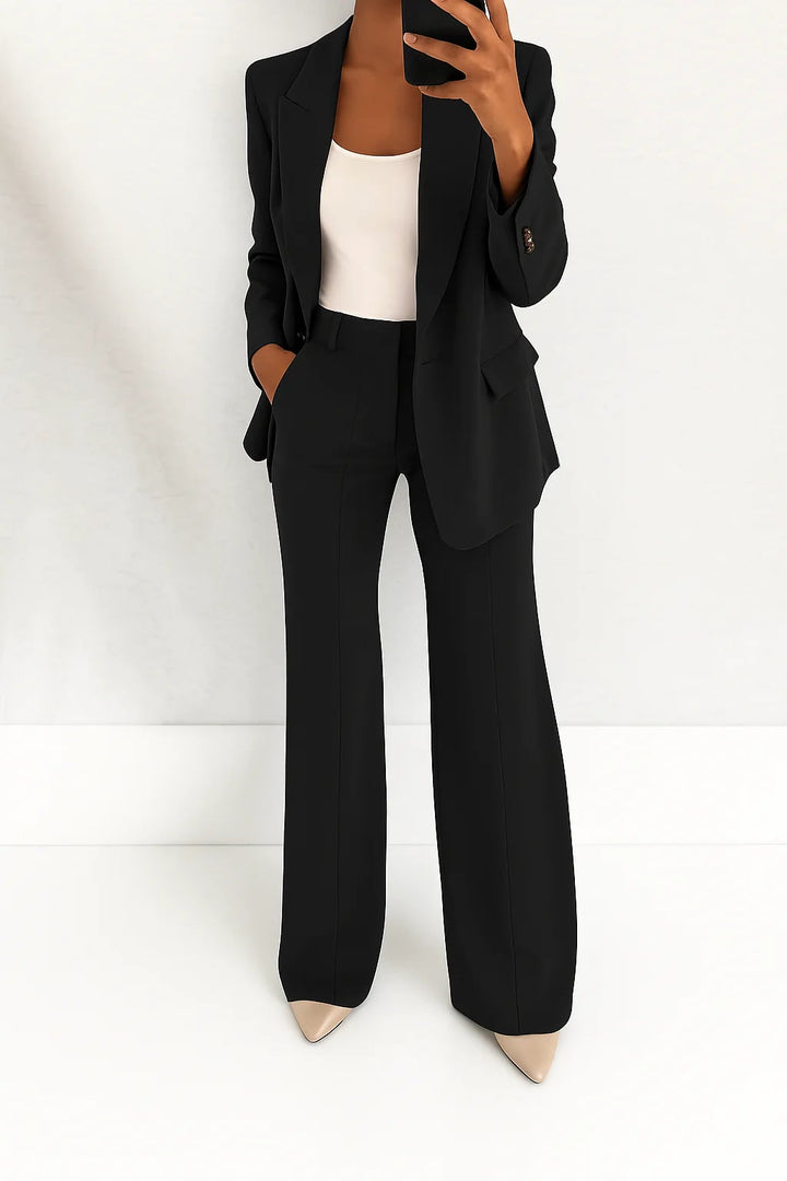Julie two-piece suit laid flat showing both the blazer and matching trousers
