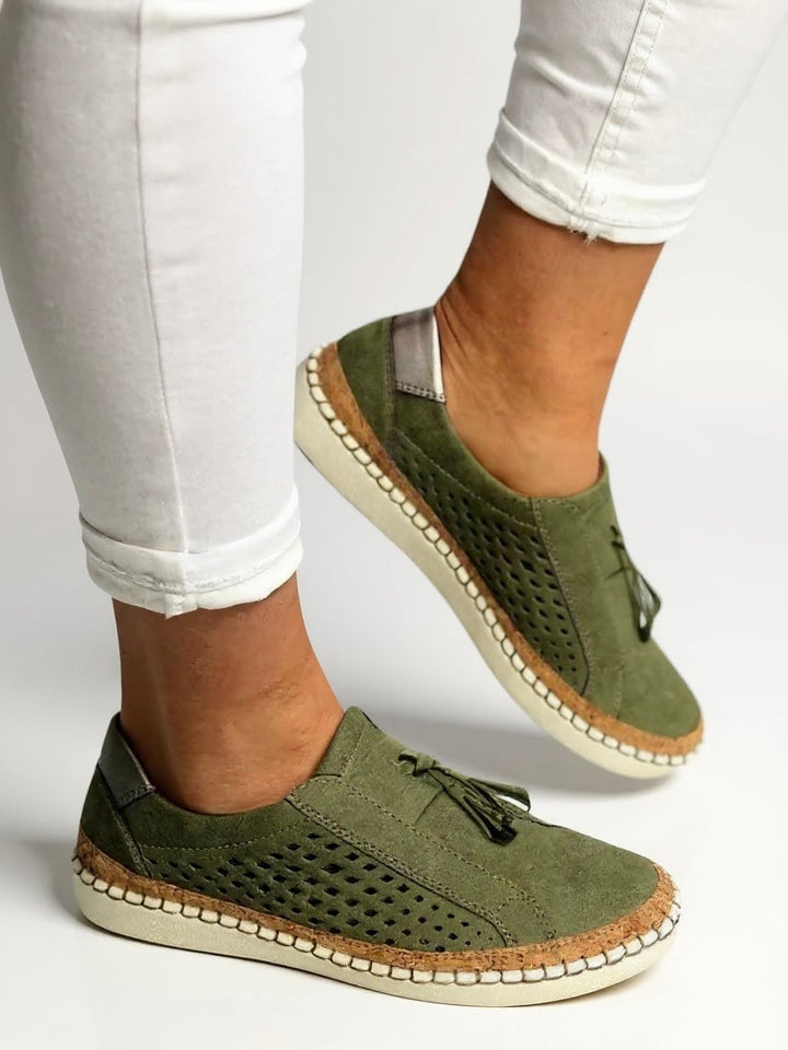 Juliette tassel slip-on shoes in white styled with tailored trousers, lifestyle flat lay