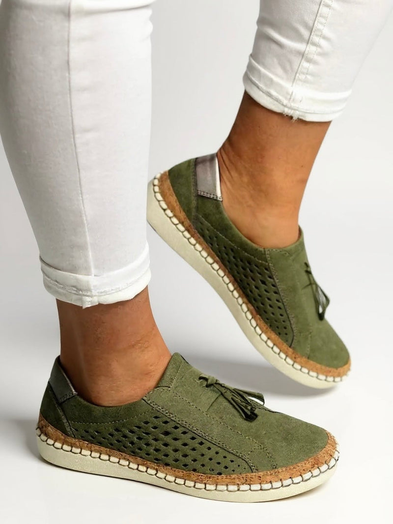 Juliette tassel slip-on shoes in white styled with tailored trousers, lifestyle flat lay