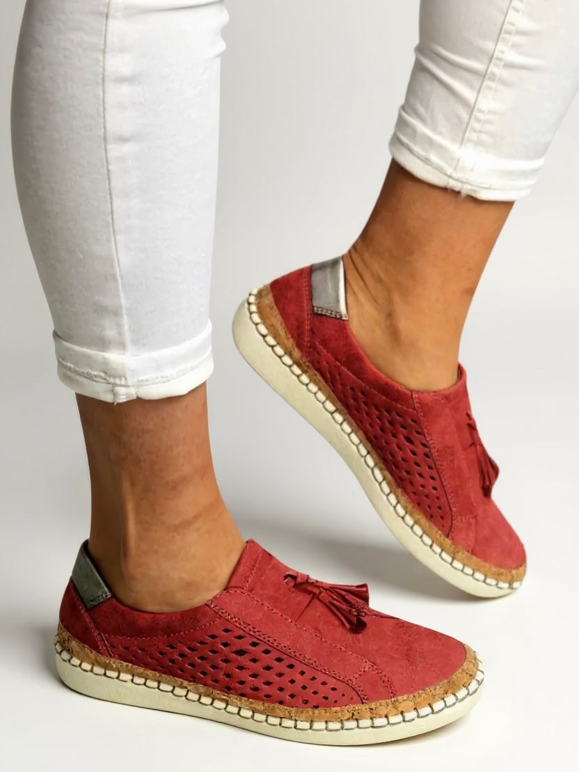 Juliette tassel slip-on shoes in red showing sole and heel construction, bottom view