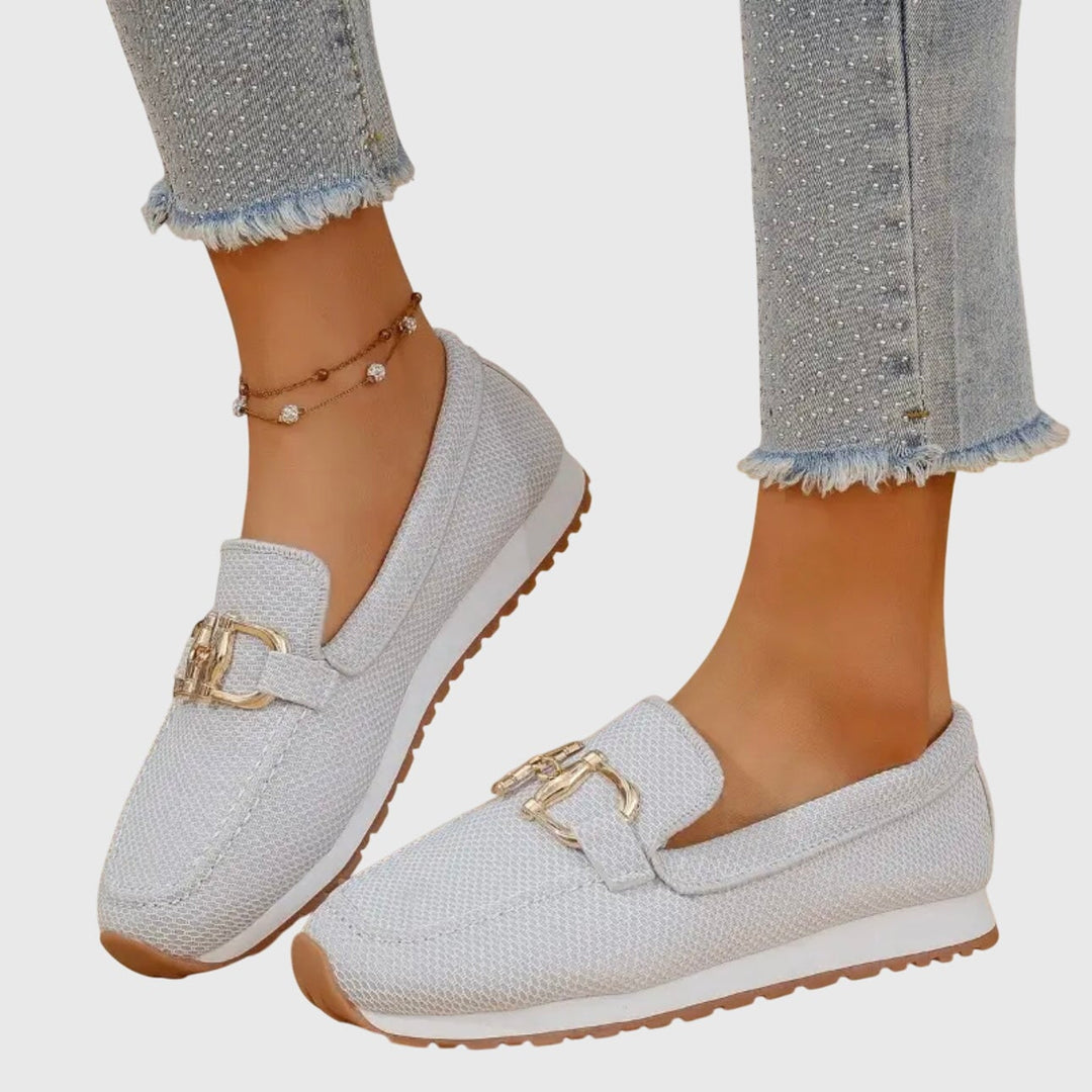 June orthopedic loafers in blue on a neutral background, top-down view