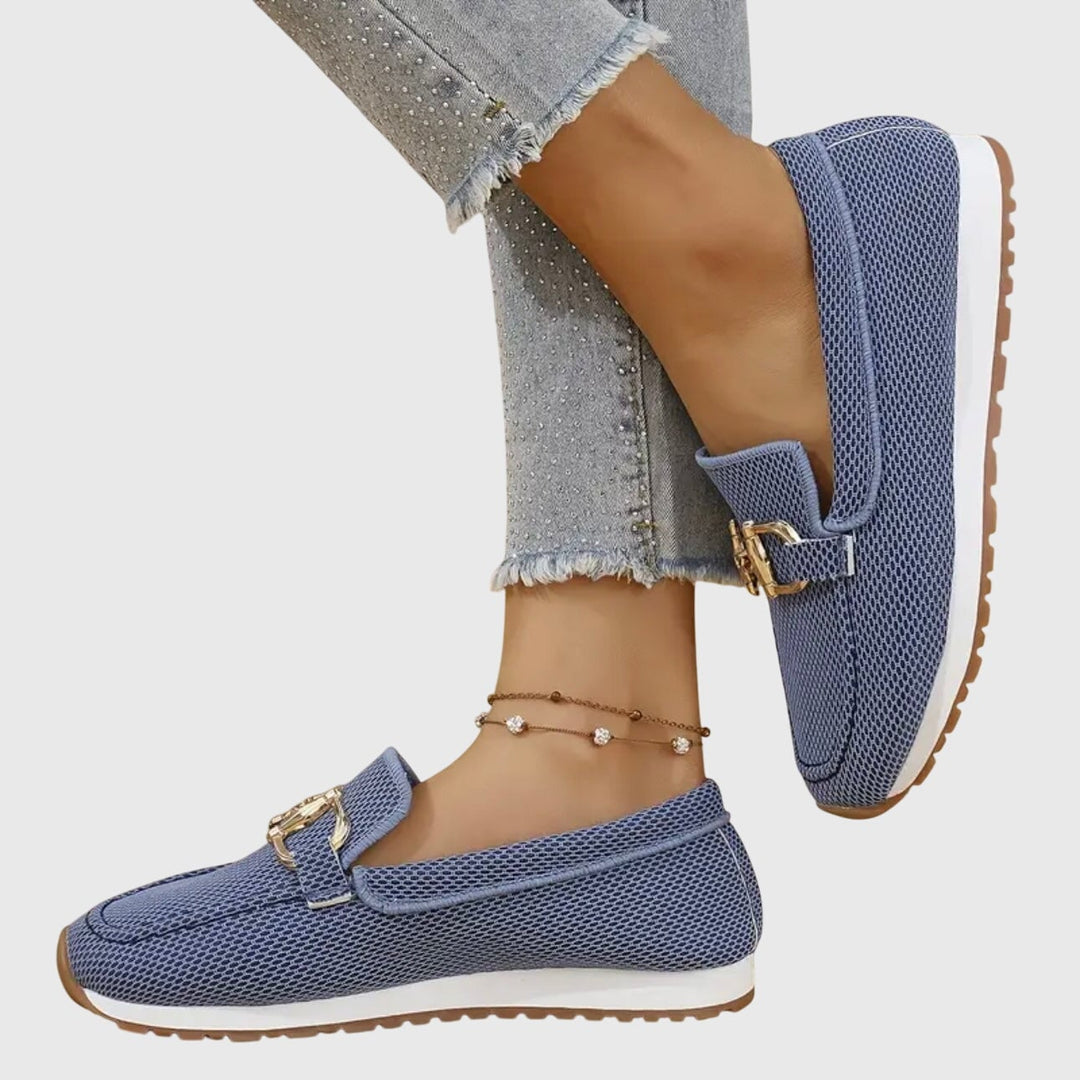 June orthopedic loafers in white worn with a midi skirt, lifestyle shot