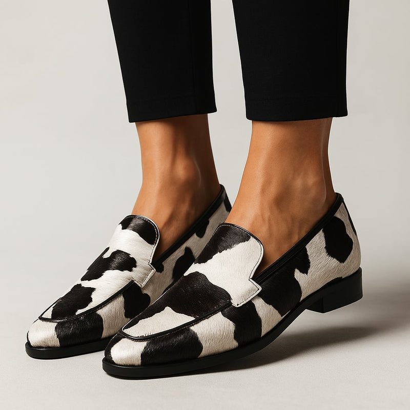 Juniper modern loafers in black and white shown from a front three-quarter angle on a clean background