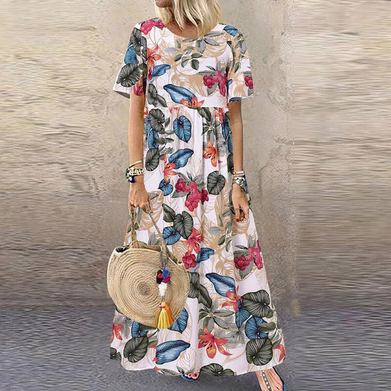 Front view of the Juniper floral maxi dress in beige showing the tailored waist and lace detailing