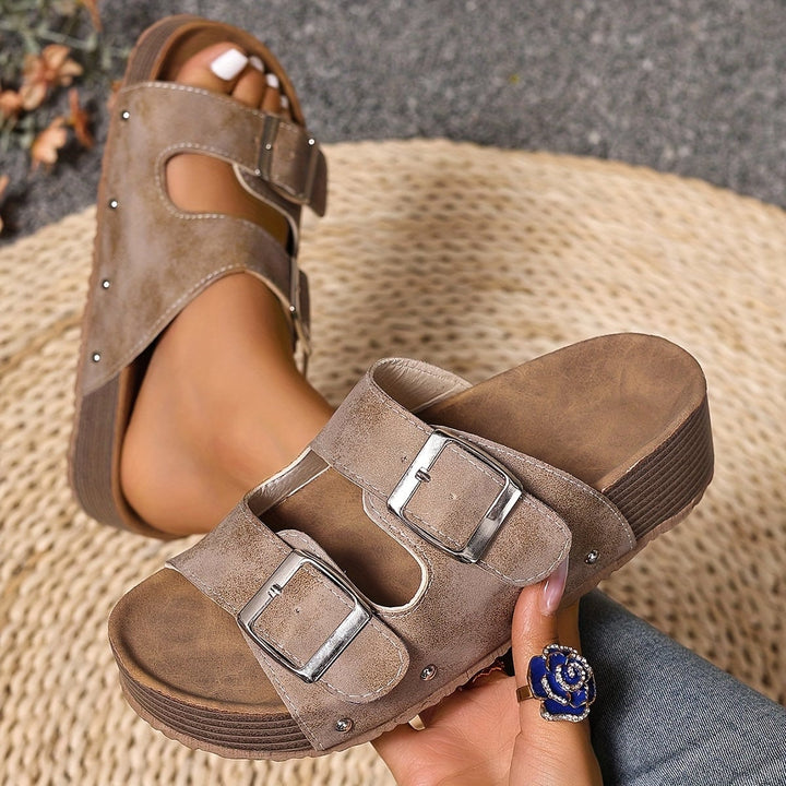 Juniper women's sandals in black, top-down view highlighting strap detail