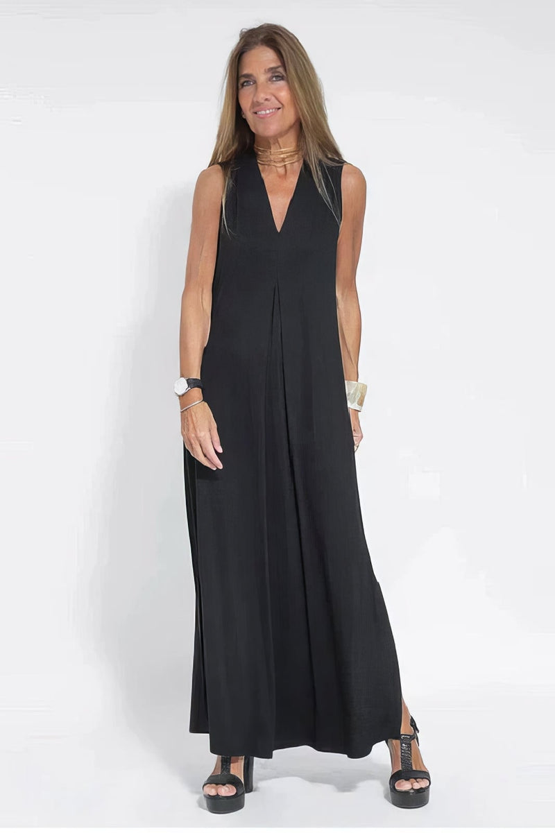Front view of a black long dress with matching cardigan styled for a polished, put-together look
