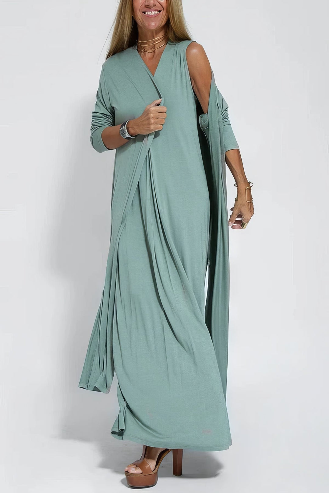 Close-up of the stretchable wrinkle-resistant fabric on an elegant long dress in green