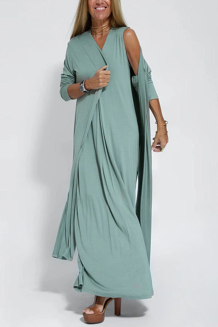 Close-up of the stretchable wrinkle-resistant fabric on an elegant long dress in green