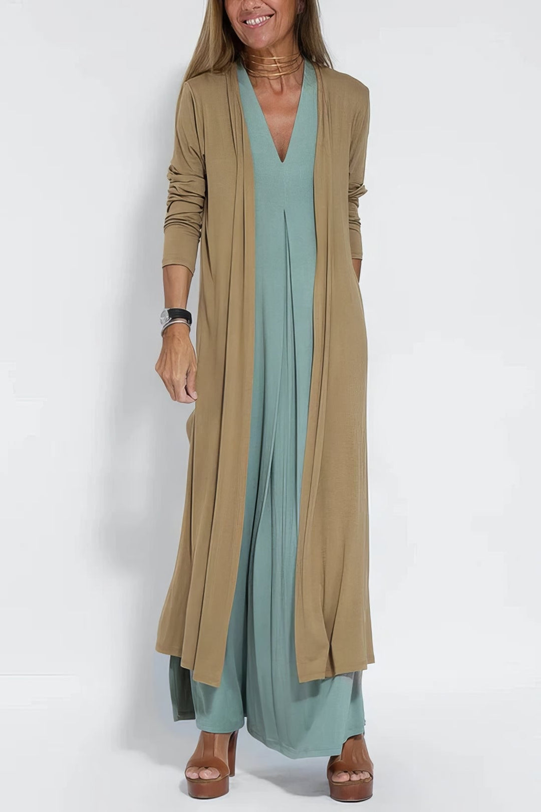 Green long dress and cardigan set shown from the back, highlighting the elegant drape and fit