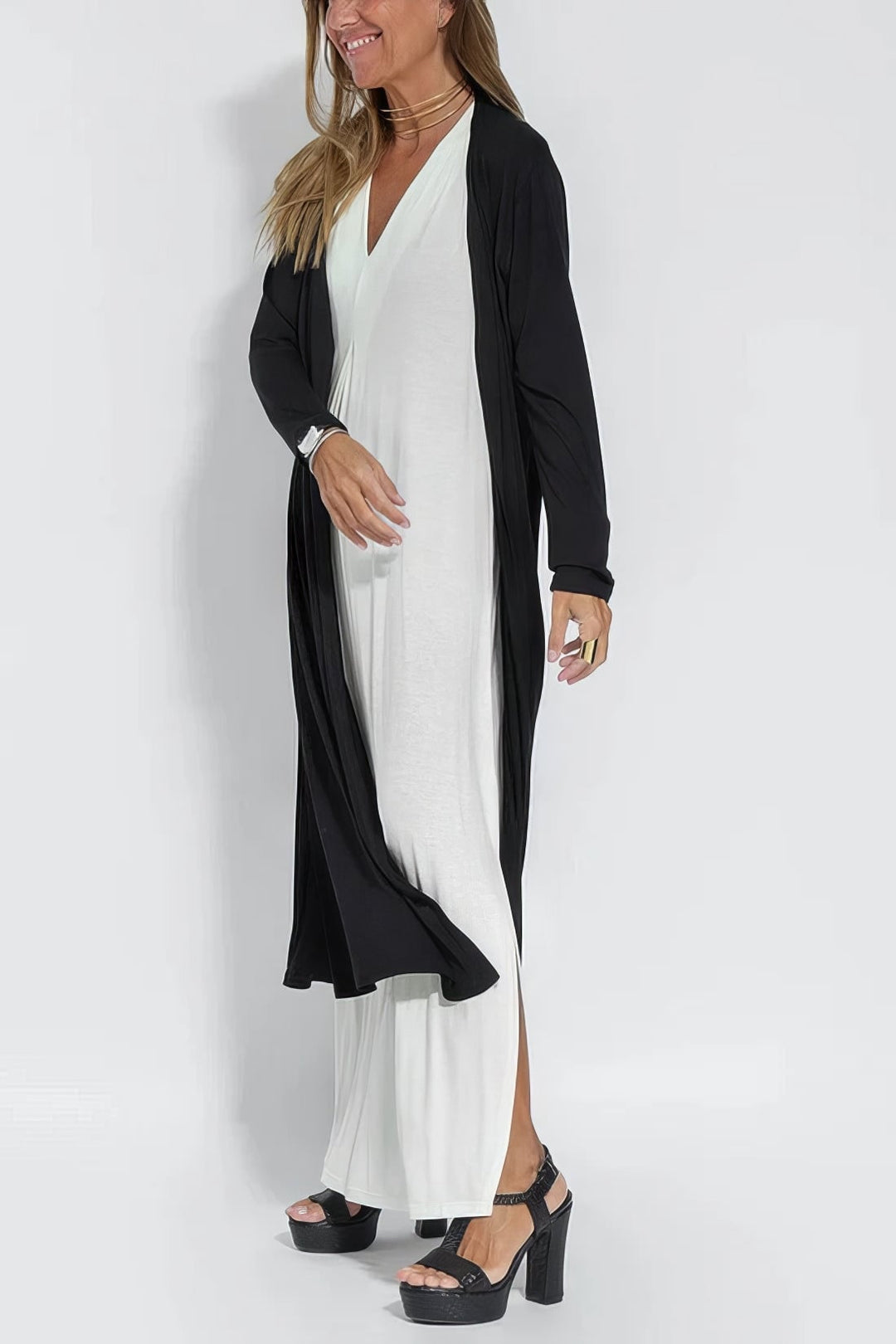 Model wearing a white long dress set, demonstrating the versatile styling options available