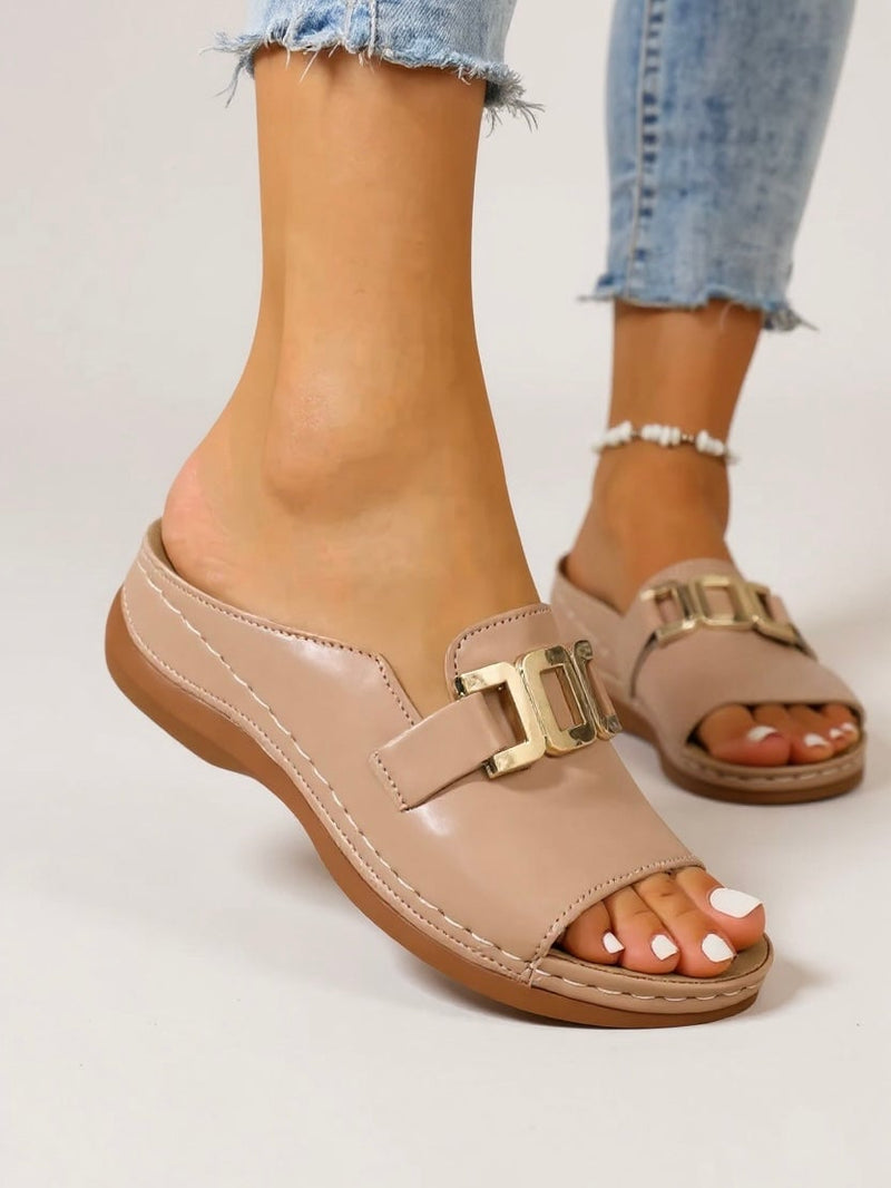 Juno cushioned gold-buckle slides in black on a clean white background