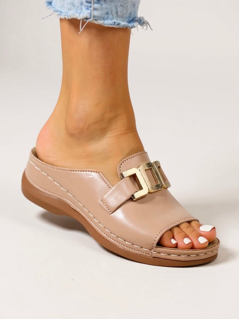 Side view of Juno gold-buckle slides showing cushioned footbed detail