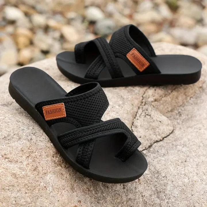 Pair of Juno sandals in black and brown side by side showing color options