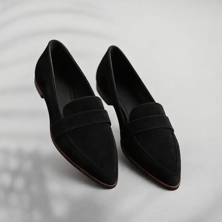Kaitlyn sleek toe loafers in black with a clean elongated silhouette on a neutral background