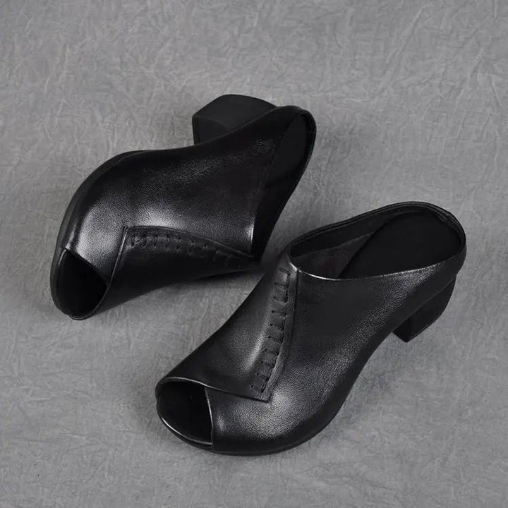 Kalani cushioned slip-on sandals in black, side profile showing plush footbed detail