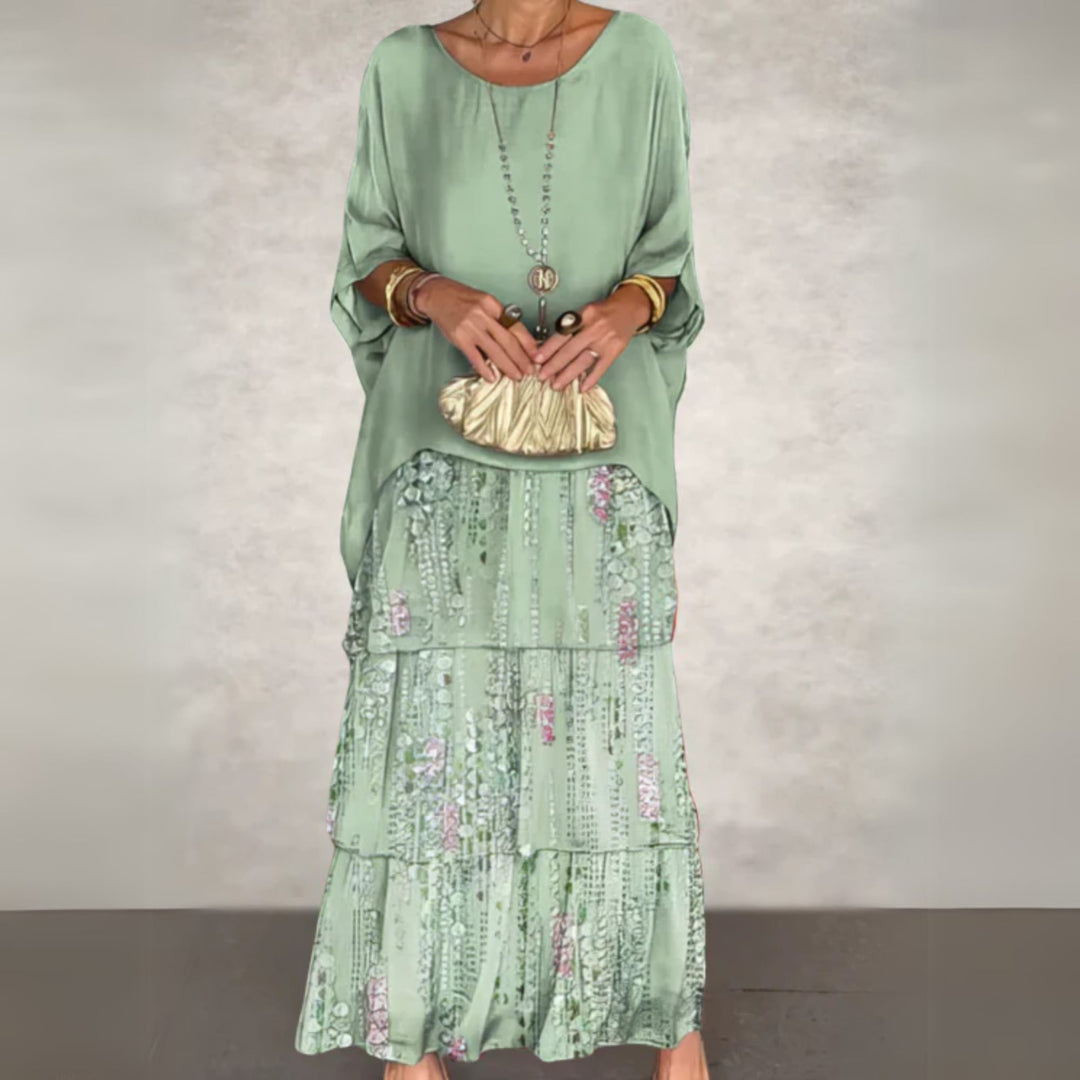 Close-up detail of the flowing fabric and elegant drape of the long maxi dress
