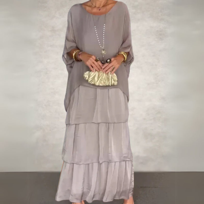 Woman in a long flowing dress styled with sandals for a casual daytime look