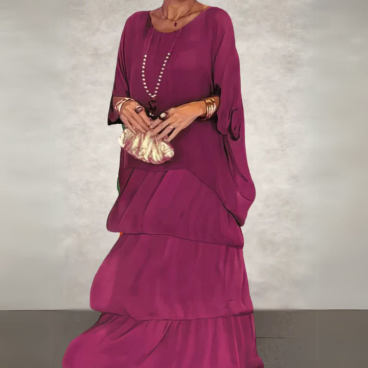 Side profile of the long flowing dress highlighting its elongated silhouette