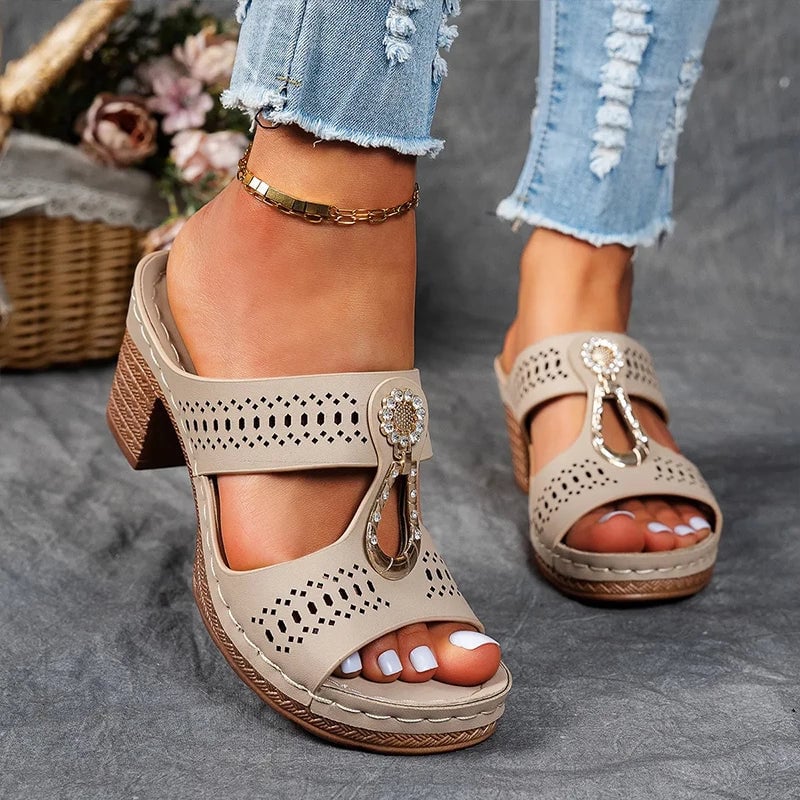 Close-up of orthopedic support sole and non-slip bottom on women's wedge sandal