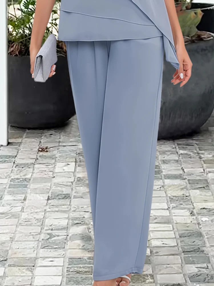 Full-length view of the navy blue feminine two-piece set showing top and pants coordination