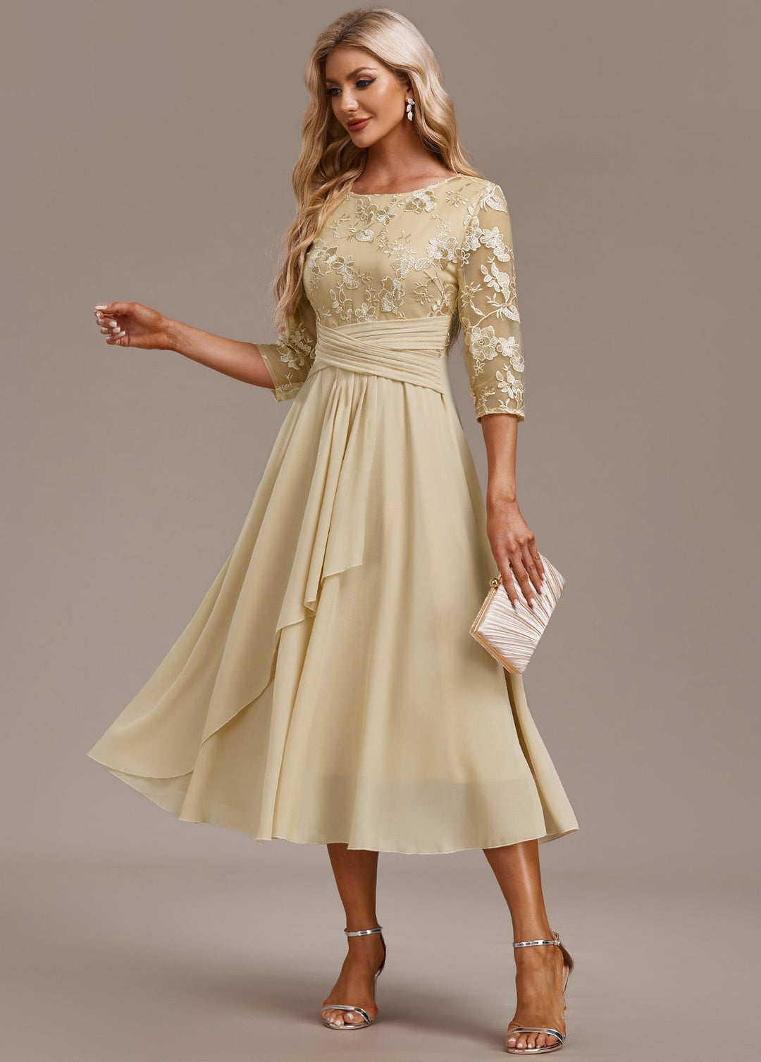 Front view of champagne floral embroidered 3/4 sleeve round neck dress with graceful A-line silhouette