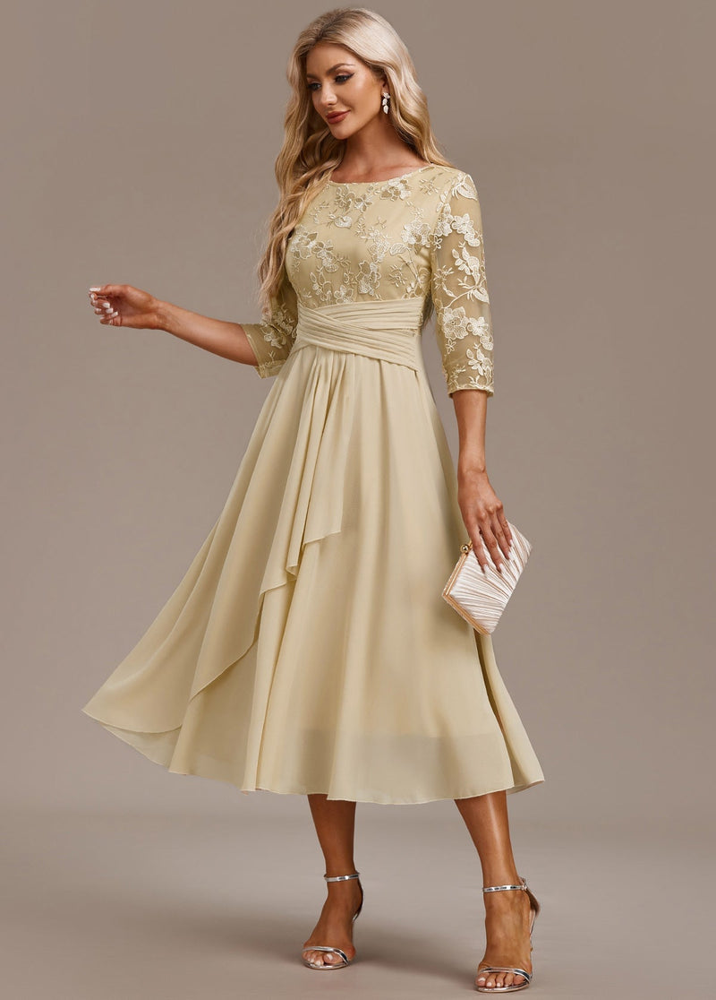 Front view of champagne floral embroidered 3/4 sleeve round neck dress with graceful A-line silhouette