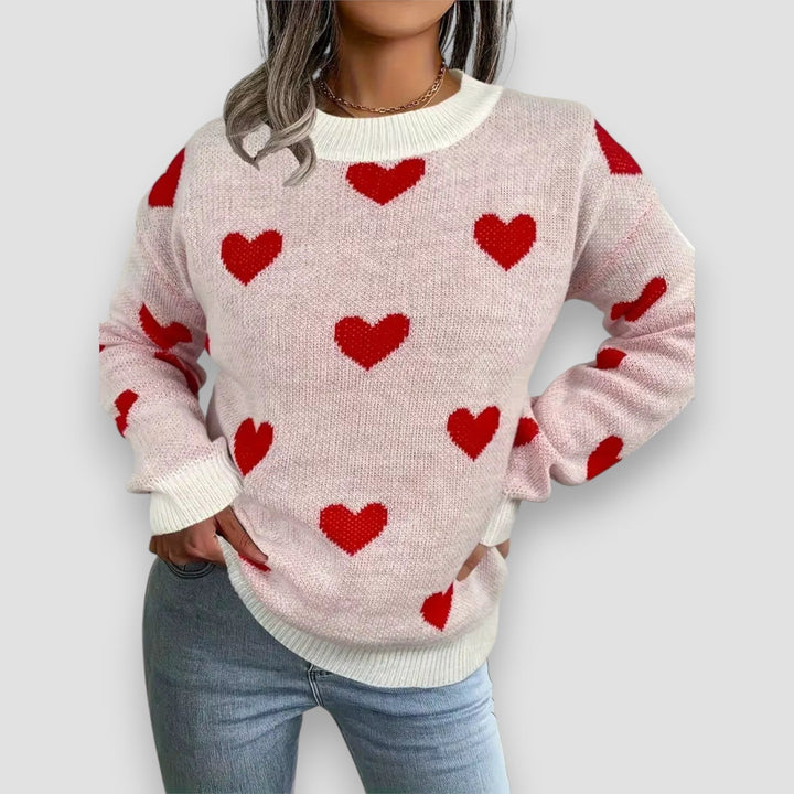 Front view of the Elegant Hearts Sweater in white on a model, featuring a flattering relaxed silhouette