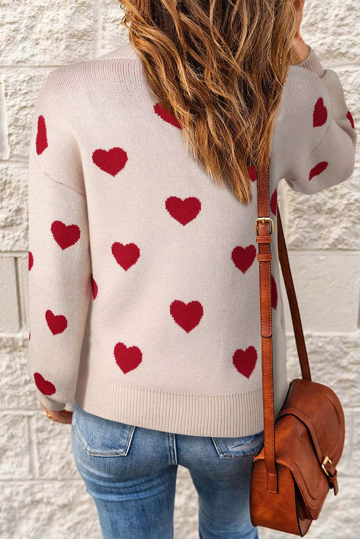 Flat lay of the Elegant Hearts Sweater in pink and white colorways side by side