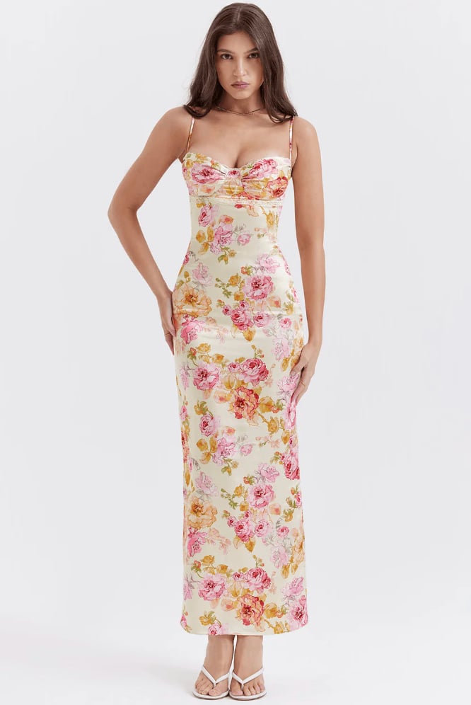 Front view of the Katherine floral spaghetti strap dress in pink on a model, showing the flowing silhouette