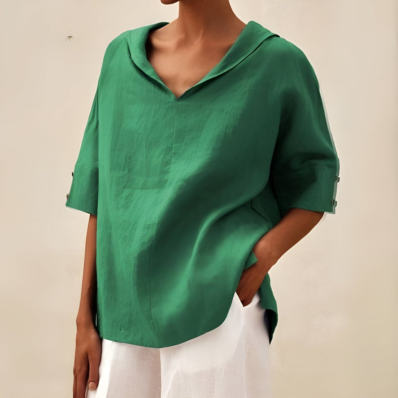 Close-up detail of the blouse fabric highlighting its lightweight, breathable texture
