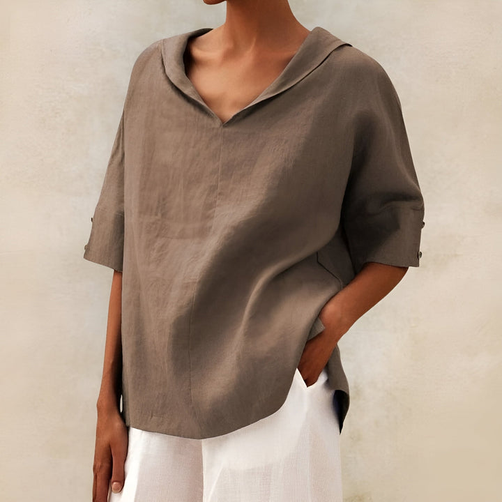 Side view of the blouse draping softly over the figure in a flattering fit