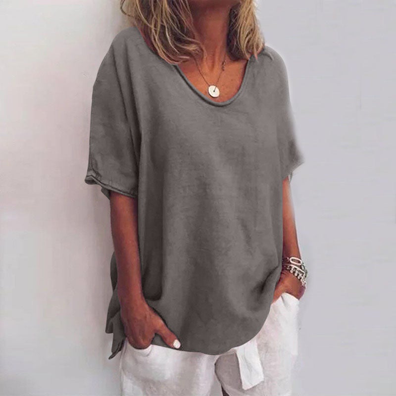 Kathleen loose blouse displayed flat lay showing its relaxed draped cut and available color options