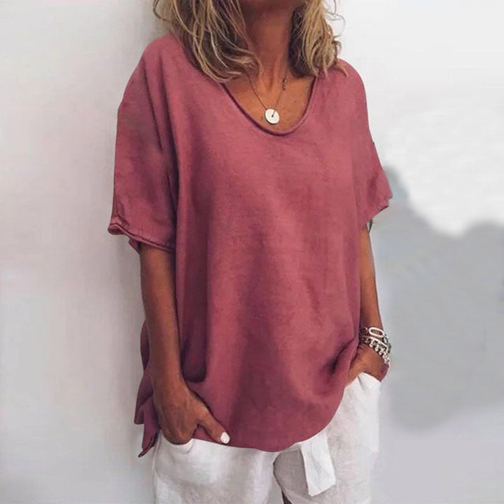 Side view of model wearing the Kathleen blouse, showing the flowy fit and flattering silhouette