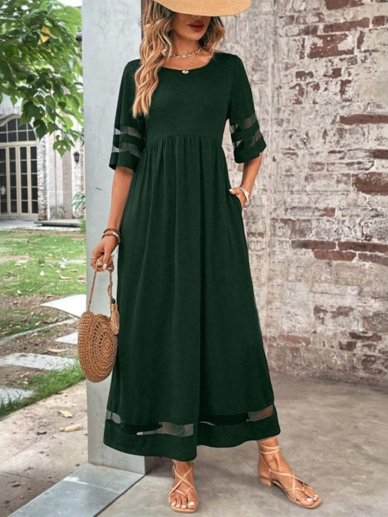 Model wearing the tummy-flattering coverage dress in red, styled for a polished day-to-night look