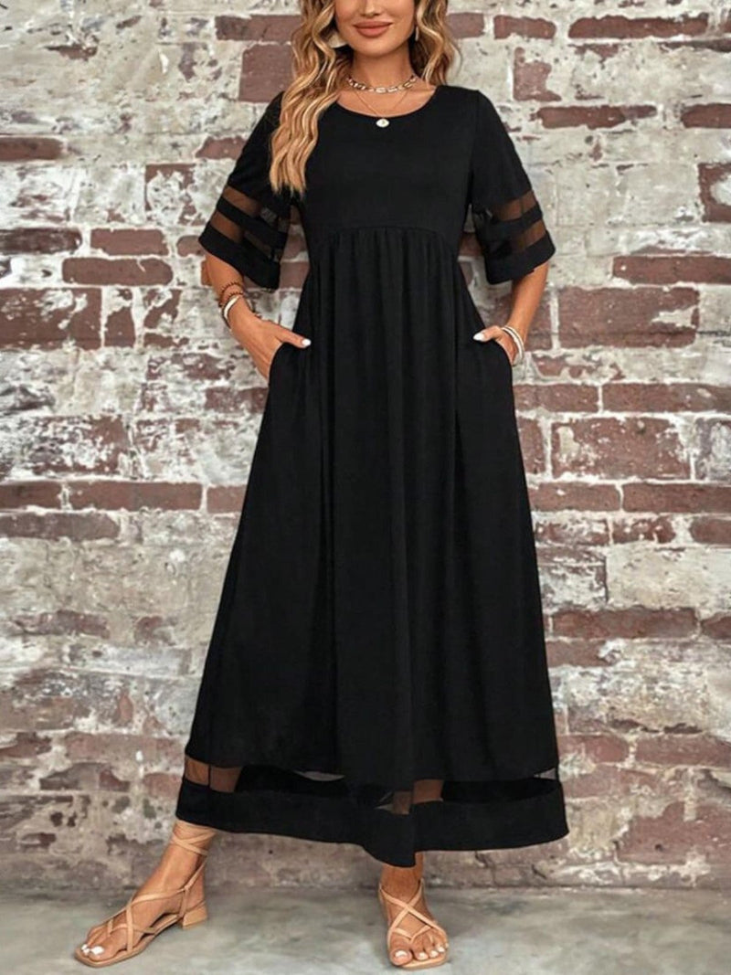 Close-up detail of the coverage dress fabric drape and clean neckline finish