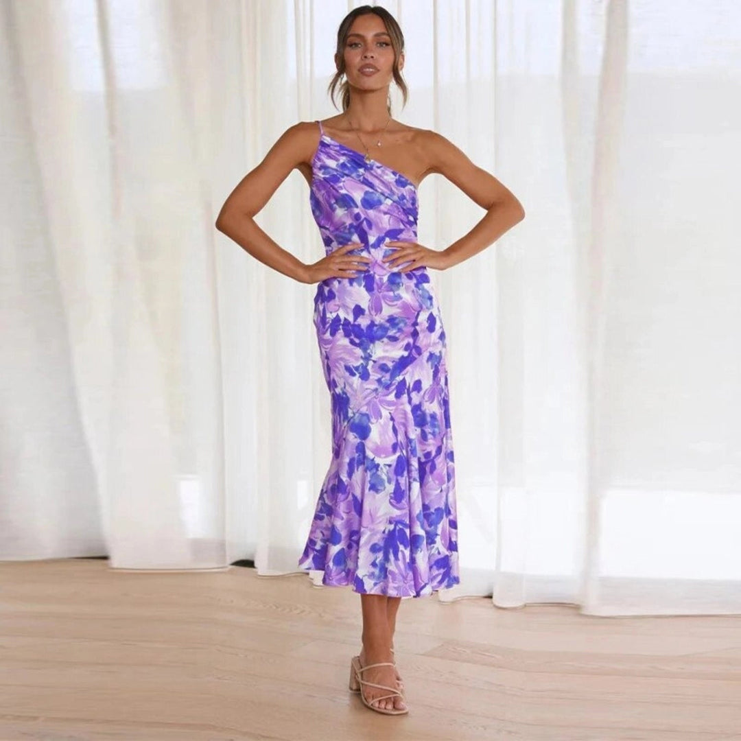 Side view of a blue floral asymmetrical maxi dress showing the flowing silhouette